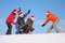 One woman pull two men on sled