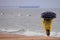 One woman with umbrella looking at the Baltic sea