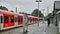 One woman with Umbrella on train platform in Germany