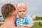 One-year-old child in the hands of the Pope in the summer