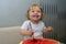 One-year-old girl eats the pulp of watermelon spoon, the first independent use of vitamins, sweet berries