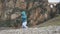 One years old baby walks near the ruins old castle in the mountains. Spain. Ronda