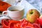 One yellow red Apple, colorful Apple marmalade slices, classic white c Cup and saucer. mini picnic in the Park