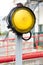 One yellow signal light with red barrier gate