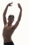 one young ballet dancer, upper body shot, arms raised, posing shirtless, photo shoot.