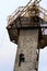 One young man is climbing on wall. Artificial rock climbing wall at outdoor. Open air climb wall in the Trukhaniv Island