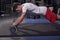 one young man, exercise barbell rollout, in gym indoors