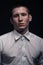 One young man, face head headshot close-up, black background