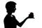 One young teenager boy or girl offering present gift silhouette