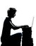 One young teenager boy or girl silhouette computer computing lap