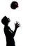 One young teenager boy girl silhouette tossing soccer football