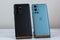 OnePlus 9 Pro 5G in Pine Green next to Samsung S21 Ultra 5G in Phantom Black.