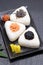 Onigiri. Rice triangle with takuan and umeboshi