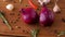 Onion, garlic, chili pepper and rosemary on table