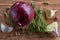 Onion, garlic, rosemary and peper on wooden board