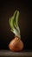 onion with green sprouts stands vertically on a cutting board on a soft brown background with light spot. moody artistic rustic