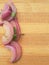 Onion pieces line on wooden background