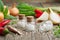 Onion, red chili peppers and bottles of homeopathic globules. Homeopathic remedies