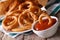 Onion rings in tomato sauce closeup. horizontal on the table