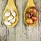 Onions and garlics on wood ladle