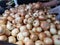 Onions vegetable are stacked on the basket for sale in the market