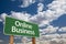 Online Business Green Road Sign and Clouds