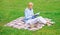 Online business ideas concept. Business picnic concept. Woman with laptop or notebook sit on rug green grass meadow