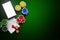 Online casino, mobile casino, mobile phone, chips cards on a green background. Gambling games. View from above