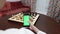 Online chess game. Phone with green screen an chess board on background.Online hobby and education.Woman holds phone.