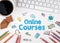 Online Courses, Business concept. White office desk