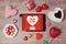 Online dating concept with digital tablet mock up and heart chocolates. Valentine\'s day romantic celebration