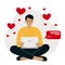 Online dating, love, romance concept. Smiling man is sitting cross-legged with a laptop with flying hearts around