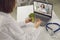 Online dietitian having telemedicine consultation with her patient via video call