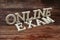 Online Exam Word alphabet letters on wooden background