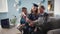 online graduation ceremony, happy female graduate in academic gown and hat with parents rejoices at being awarded