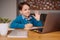 Online learning, boy using laptop for his classes