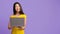 Online Offer. Smiling Pensive Asian Woman Holding Laptop And Looking Away