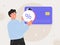 Online payment cashback concept. Man holding shape with percent debit or credit card and paying shopping online. Virtual