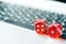 Online poker casino theme. Red dice on laptop