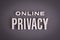Online Privacy sign lettering on gray