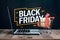 Online sale and Black Friday concept, laptop and shopping cart