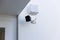 Online Security CCTV camera surveillance system outdoor of house. A blurred night city scape background. Real time Modern CCTV cam