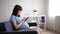 Online shopping - beautiful young pregnant woman with laptop sitting on sofa at home