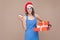 Online shopping in christmas. Businesswoman holding box, card an