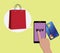 Online shopping concept using mobile devices smartphone and shooping bags