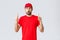 Online shopping, delivery during quarantine and takeaway concept. Impressed, curious employee in red uniform cap and t