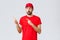 Online shopping, delivery during quarantine and takeaway concept. Impressed and wondered courier in red t-shirt with cap