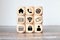 Online shopping or e-commerce concept with online business icons on wooden cubes against white background