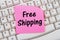 Online shopping with Free Shipping, computer keyboard and sticky