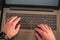 Online shopping-male hands typing on laptop keyboard